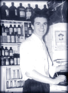 Young Tom working at Lauer's drugstore.