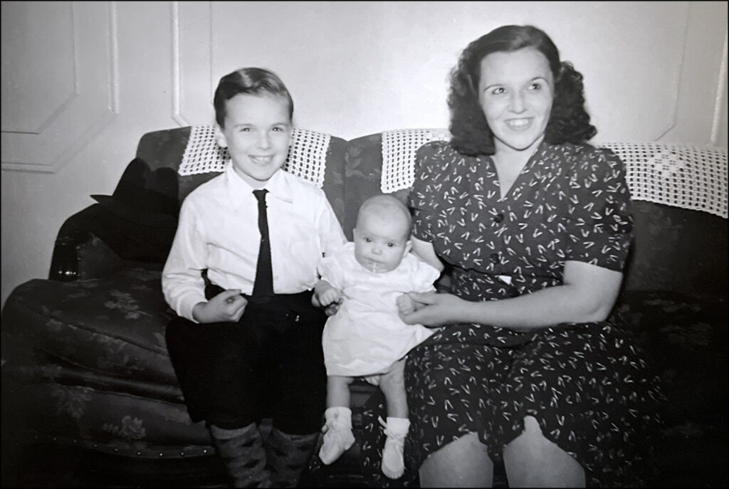 Six-year-old Tom with his mother and his baby sister, Mimi.